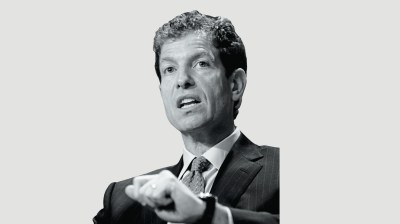 Black-and-white portrait of a middle-aged white man in a suit