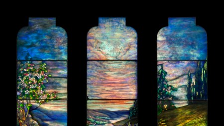 An image of the three-pane stained glass window The Goddard Memorial Window by Tiffany Studios which recently sold at a Christie's design auction on June 12, 2025.