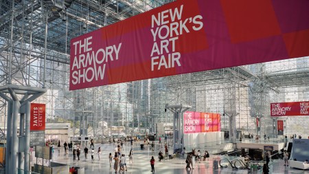 View of Javits convention center in New York with signage reading 'The Armory Show: New York's Art Fair.'