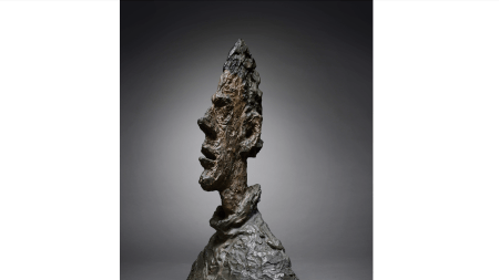 A jagged bronze bust of a man.