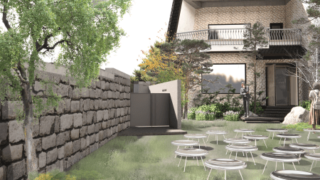 Outdoor area with tables and stone wall.