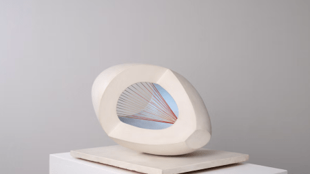 A wooden sculpture with strings.